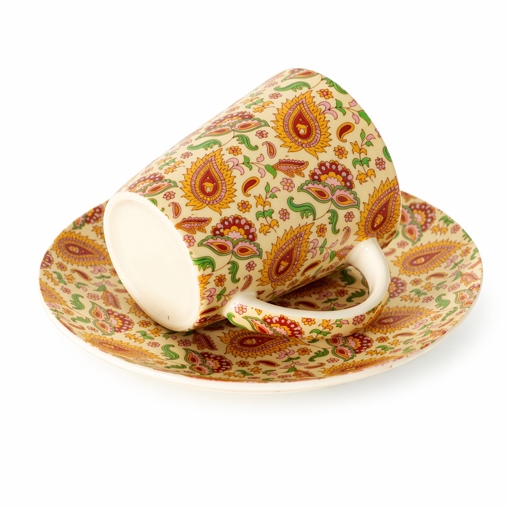 Taza de café de cerámica floral con platillo