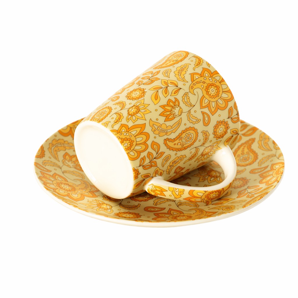 Taza de café de cerámica floral con platillo