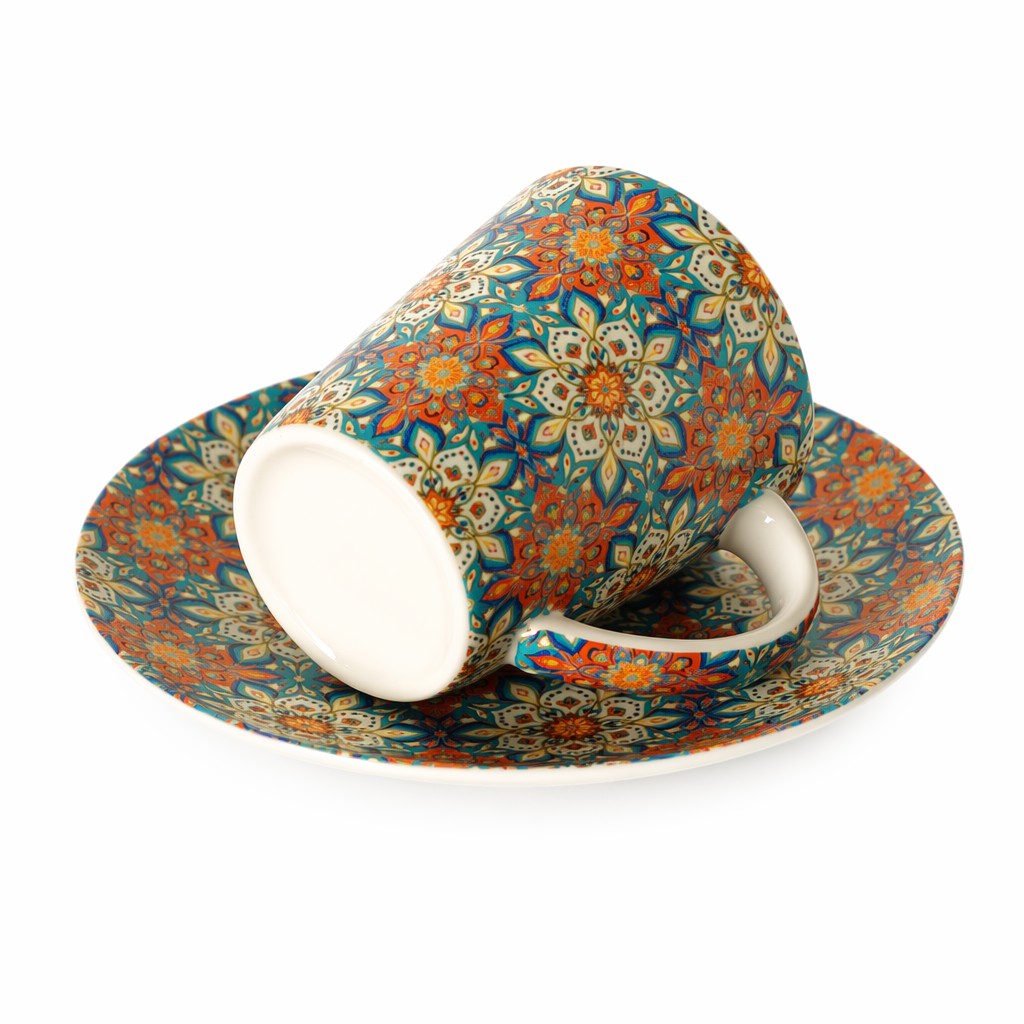 Taza de café de cerámica floral con platillo